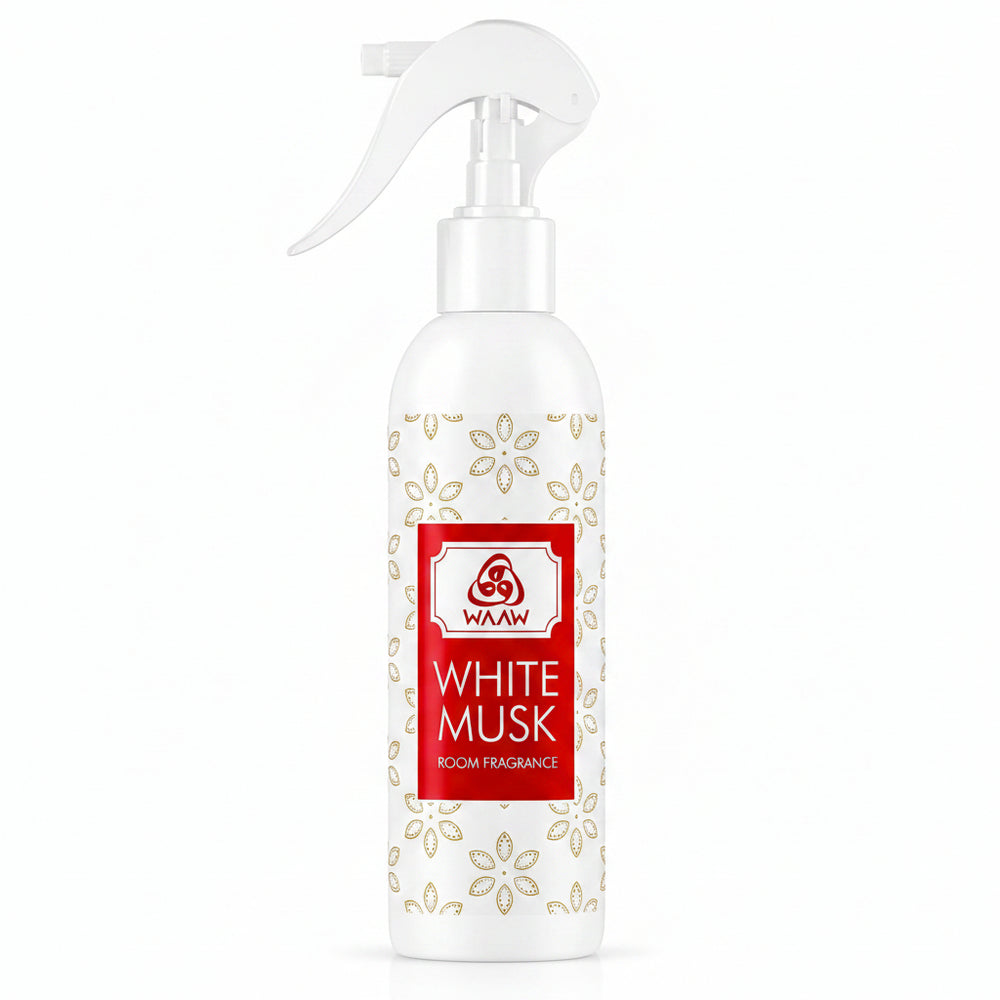 A white spray bottle of Waww White Musk room fragrance, featuring a white trigger spray top, a red and white label, and a gold floral pattern on the bottle body.