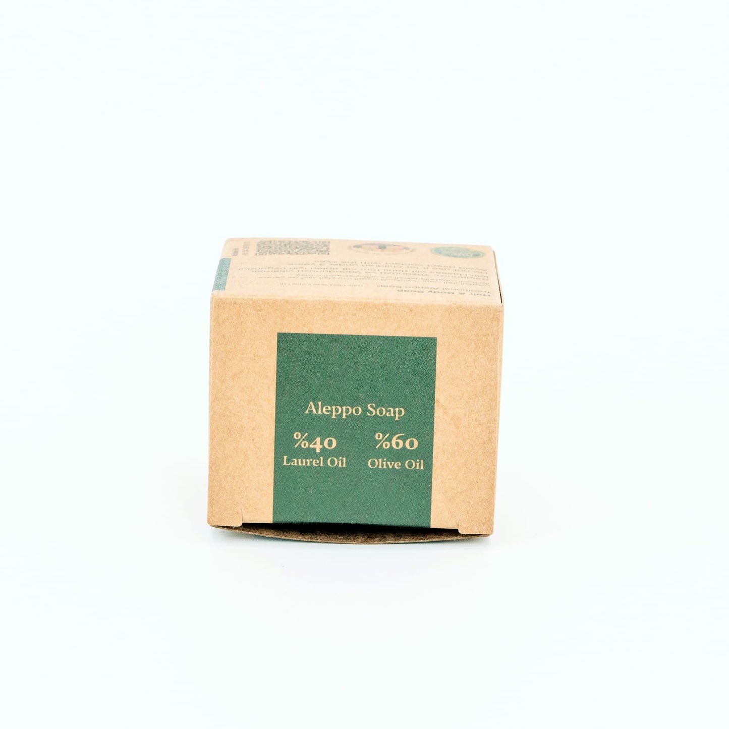 Bar of Aleppo Soap with cardboard packaging on a white background