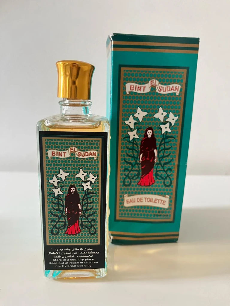 A bottle of Bint El Sudan Eau de Toilette perfume with a gold cap and a matching green patterned box, both featuring an illustration of a woman in a red dress.Bint El Sudan – Chypre EDT 100ml