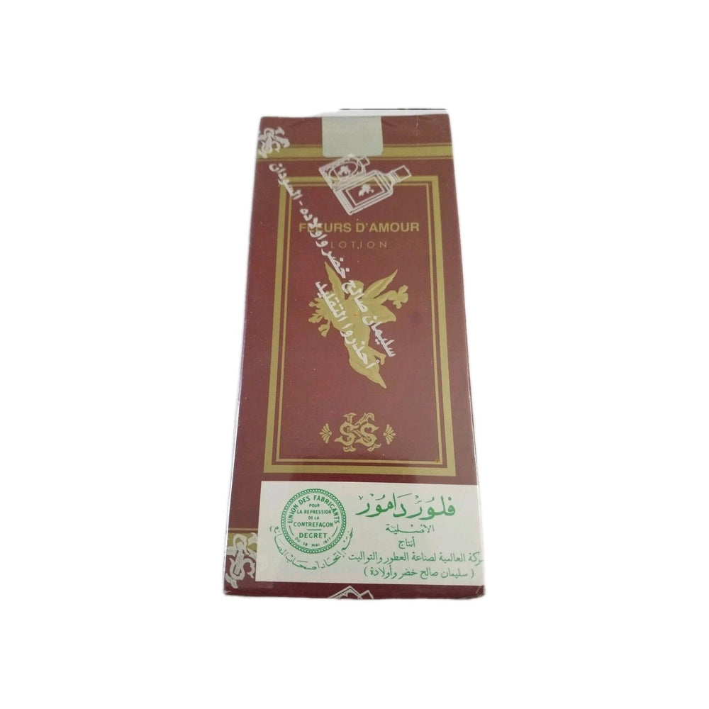 A tall rectangular box of Moroccan mint tea, featuring a deep red-brown background with gold foil borders, Arabic calligraphy, and a white label at the bottom.