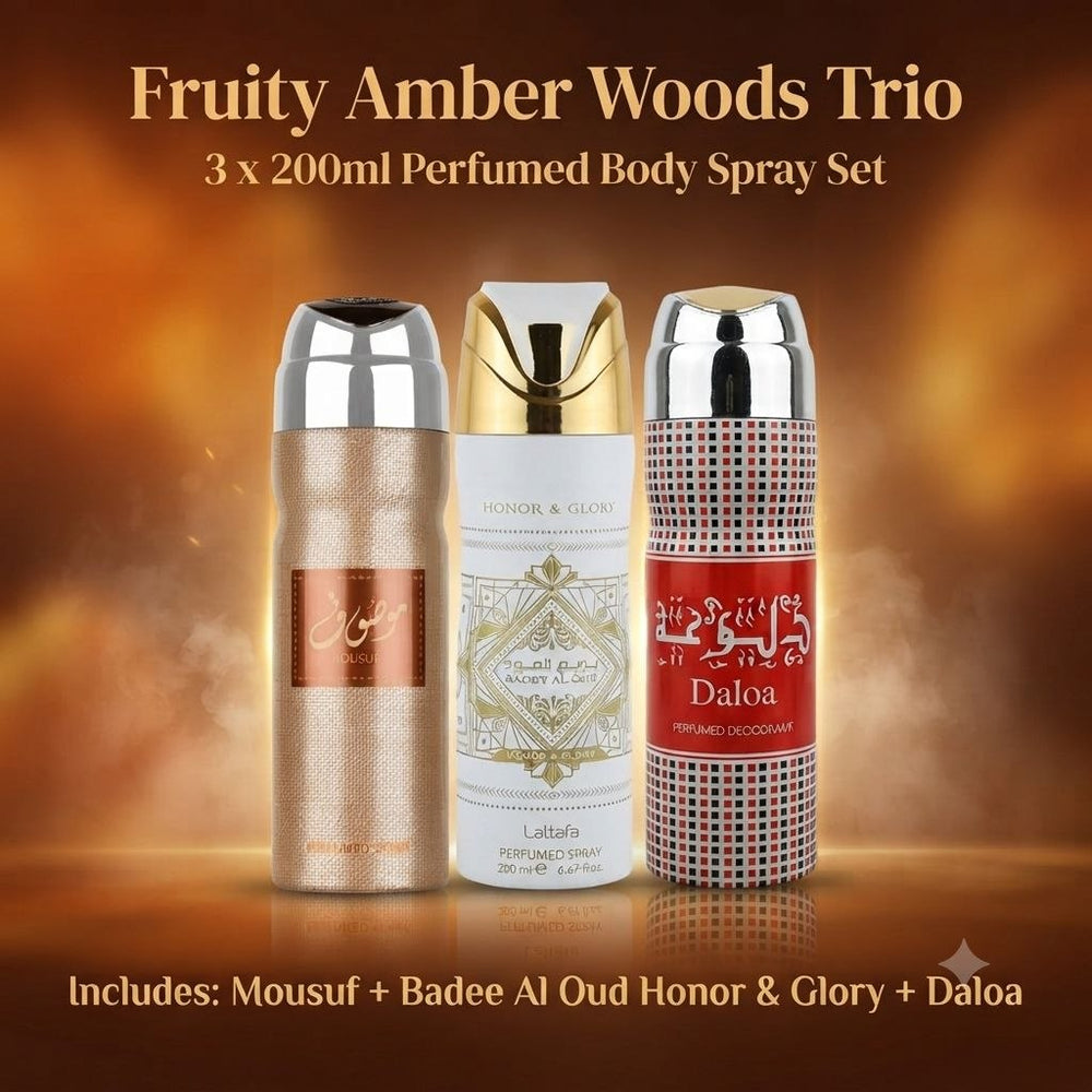 Three 200ml perfumed body spray bottles from a Fruity Amber Woods Trio set, displayed against a warm golden-brown gradient background. The set includes Mousuf, Badee Al Oud Honor & Glory, and Daloa.
