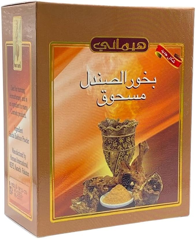 A box of Persian saffron powder (Bakhra Shindil Masbouq) by the brand Heymari, featuring a brown and orange design with an illustration of a traditional saffron crocus flower and a small bowl of yellow powder.