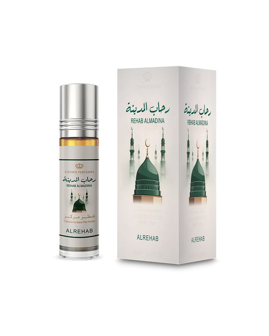 A bottle of Alrehab Rahmat Al-Dunya perfume oil with a silver cap stands next to its white packaging box, both featuring green mosque illustrations and Arabic text on a white background.Rehab Almadina Perfume Oil 6ml – Al Rehab