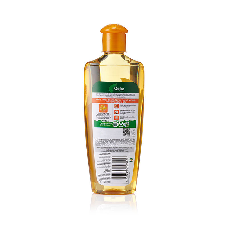 Veda baby shampoo bottle with amber liquid and an orange cap, showing the back label on a white background.
