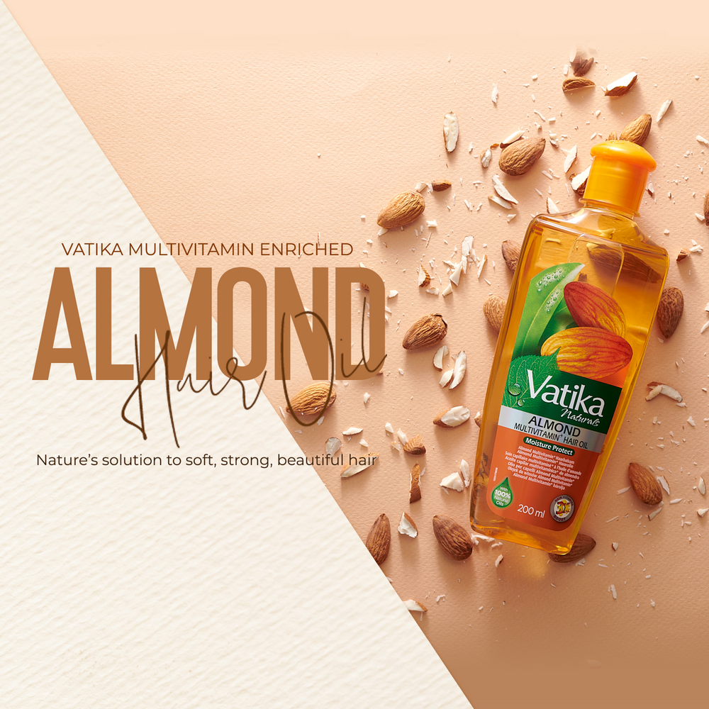 Vatika Almond Hair Oil bottle displayed on a peach background with scattered almonds and coconut pieces, alongside large text reading 'VATIKA MULTIVITAMIN ENRICHED ALMOND Hair Oil'.