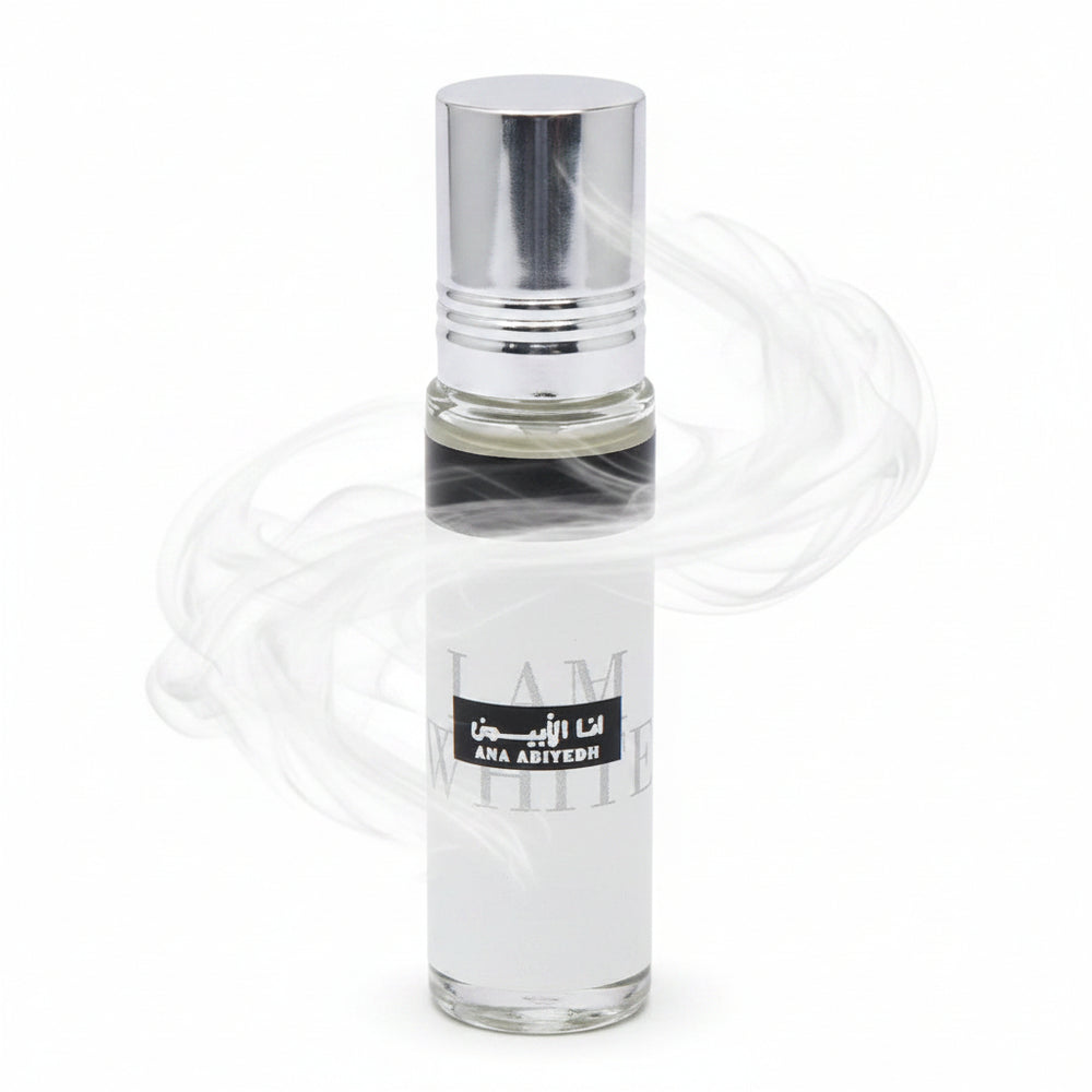 Clear glass perfume bottle with a black label on a white background