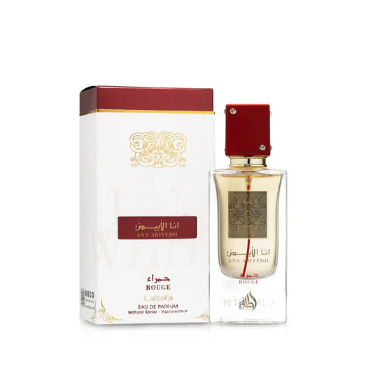 A clear glass bottle of ana abiyedh rouge eau de parfum 60ml with red cap gold accents from the ana abiyedh collection