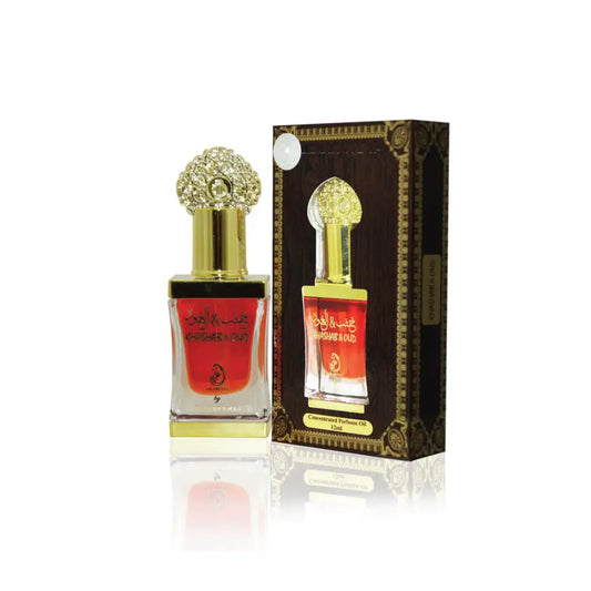 Perfume bottle with gold cap and red label next to its packaging on a white background