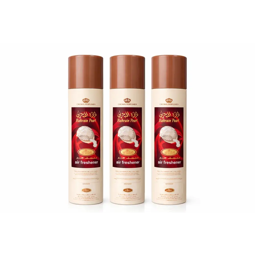 Three identical bahrain pearl air freshener cans with cream body brown caps and red arabic labels by rehab perfumes