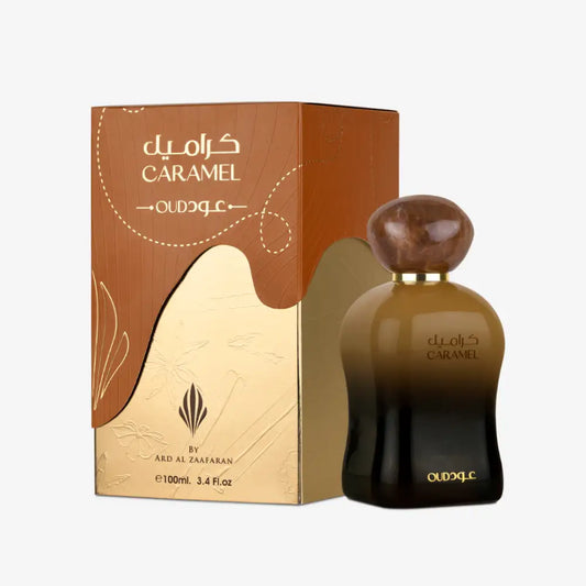 Caramel oud edp 100ml by ard al zaafaran with a gradient brown to black glass bottle and amber marble stopper in branded box