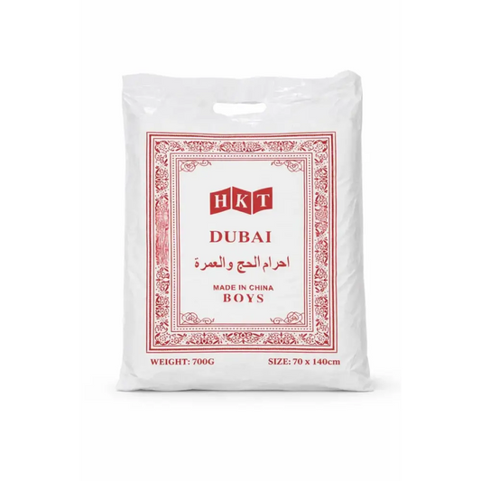 White plastic bag with red ornate border and hkt dubai branding containing boys clothing for umrah complete essentials set with digital tasbih and activity book
