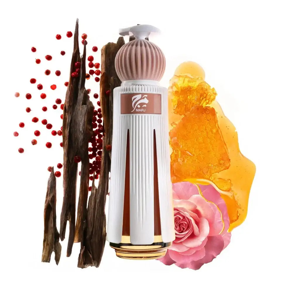 Perfume bottle with vanilla beans, rose, and amber on a white background