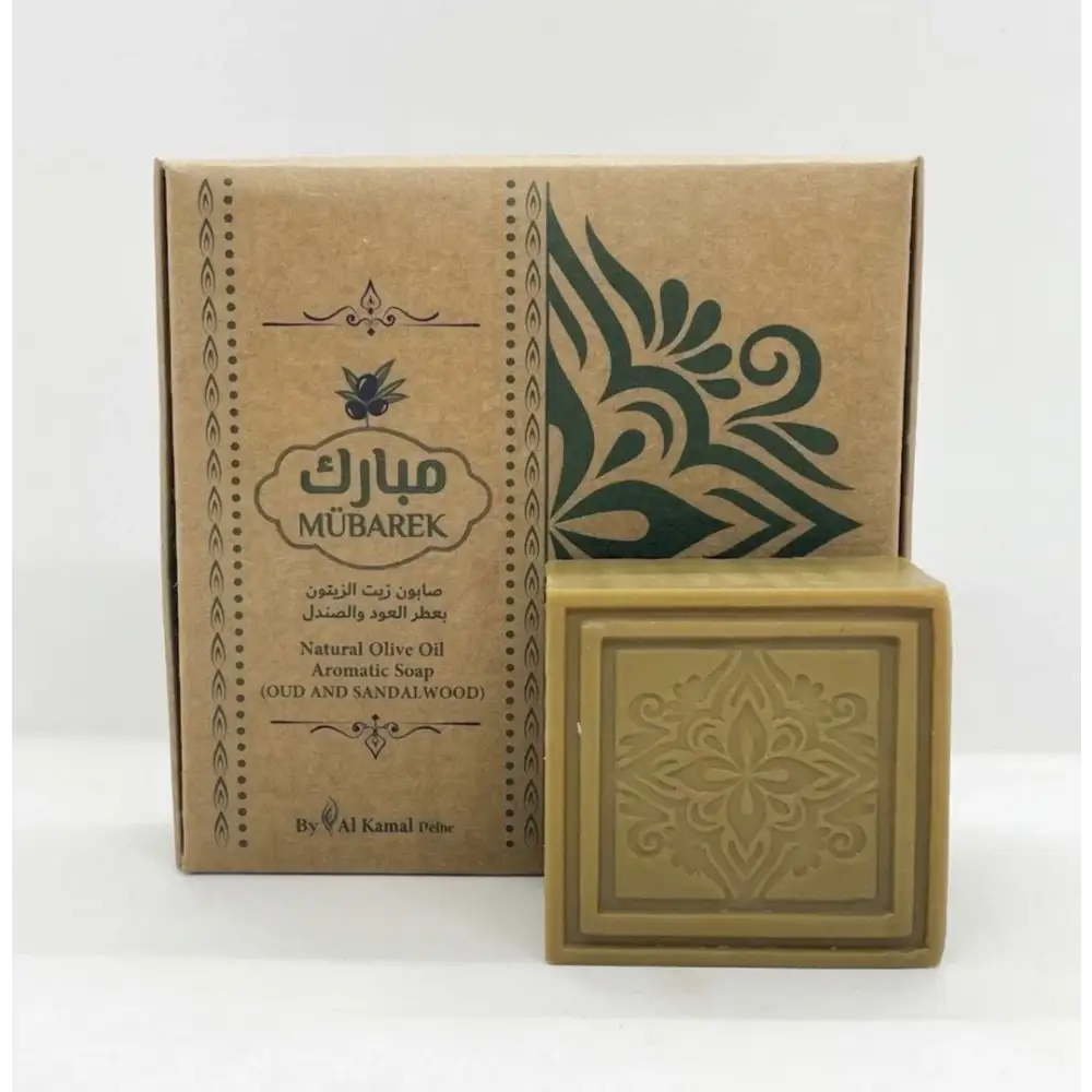 A square beige natural olive oil soap bar with an embossed floral design from mübarek oud and sandalwood collection