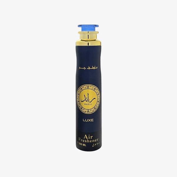 A tall cylindrical air freshener bottle with a dark navy blue body, gold accents, and a blue cap, shown on a plain light gray background. Ra’ed Luxe Air Freshener 300ml by Lattafa