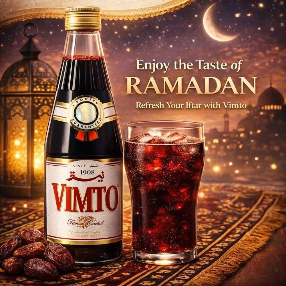 A glass bottle of dark red vimto arabic fruit cordial syrup 710ml with a gold cap and label for ramadan drink