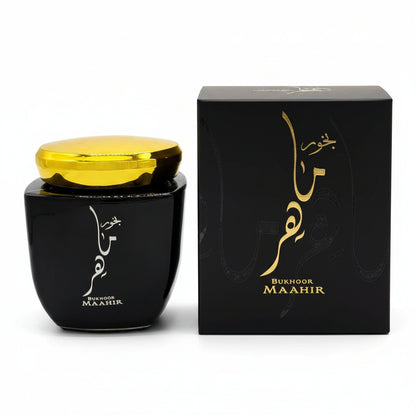 Black container with gold lid and 'Bukhoor Maahir' packaging on a white background