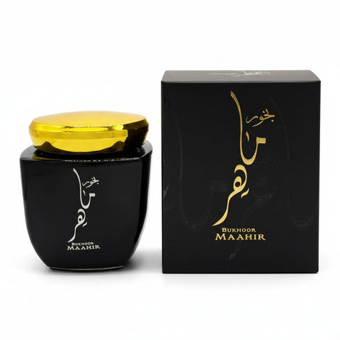 Black container with gold lid and 'Bukhoor Maahir' packaging on a white background