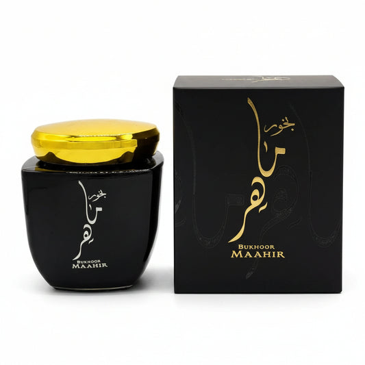 Black container with gold lid and 'Bukhoor Maahir' packaging on a white background