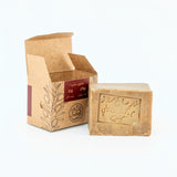 Bar of soap with a brown packaging box on a white background