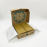 Gold chocolate bars in a branded box on a white background