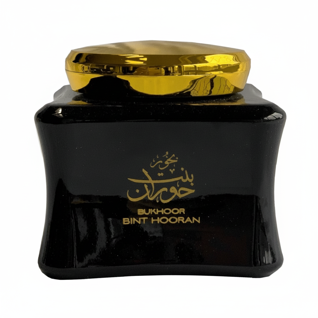 Black container with gold lid and text on a white background