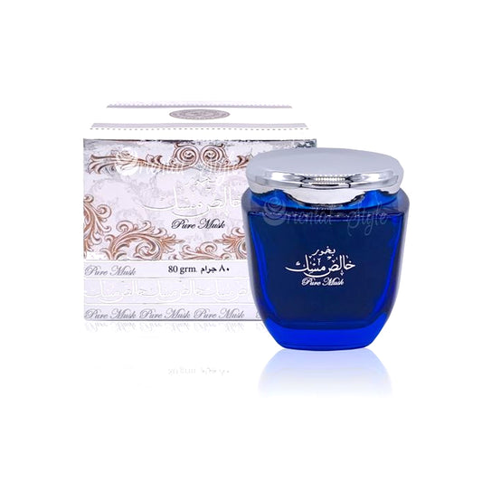A blue cosmetic jar with a silver lid placed in front of its white and silver patterned box. The product packaging and jar are labeled 'Pure Mask'.Bukhoor Pure Musk 80g – Ard Al Zaafaran