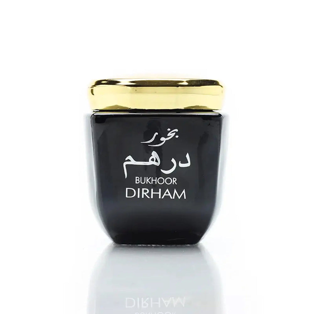 Black container with gold lid labeled 'Bukhoor Dirham' on a white background