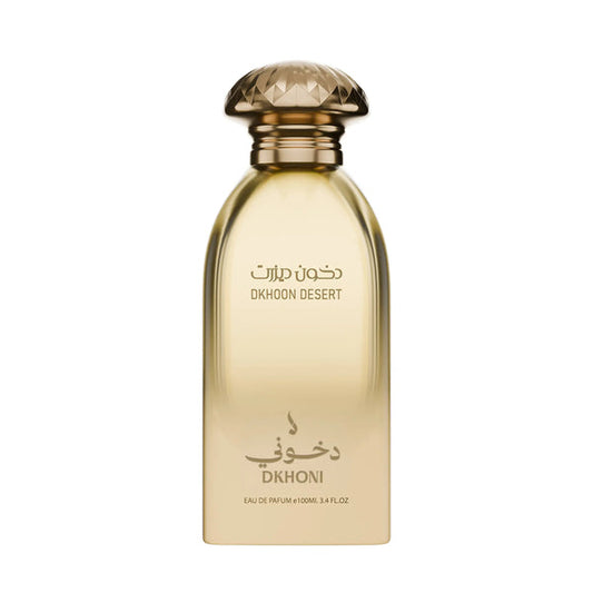 A bottle of Dkhoon Desert Eau de Parfum with a faceted gold cap and a translucent golden-amber bottle, featuring Arabic and English text on a plain white background.