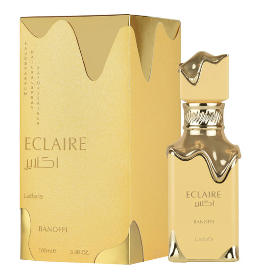 Gold Eclaire perfume bottle and packaging on a white background