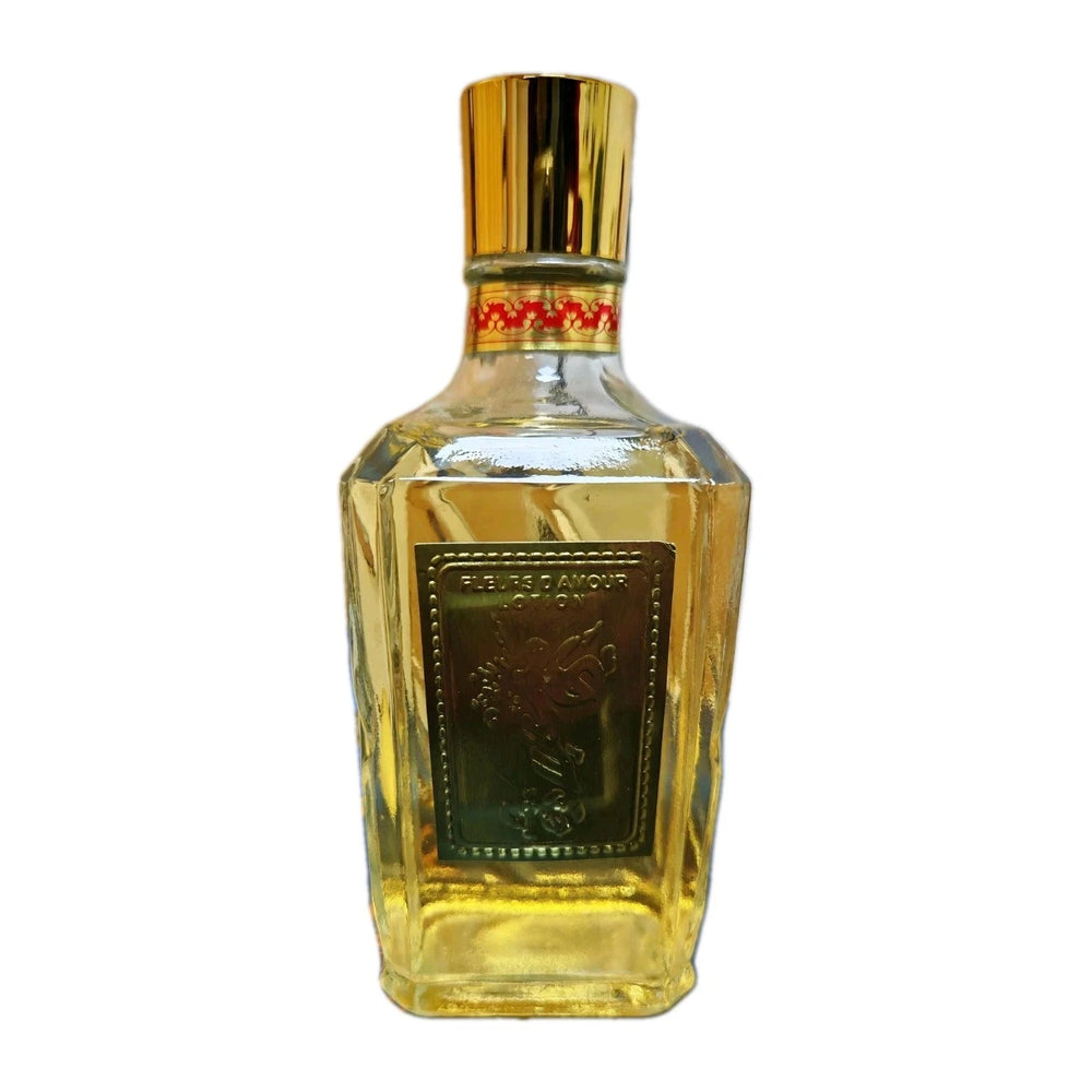 A faceted glass bottle of Perseus Amour 100% pure tequila with a gold cap and a dark green front label, shown on a plain white background.