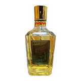 A faceted glass bottle of Perseus Amour 100% pure tequila with a gold cap and a dark green front label, shown on a plain white background.