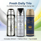 A 3-piece men's body spray set labeled 'Fresh Daily Trio' featuring Dirham, Fakhar Lattafa (silver), and Taj Al Malik (blue and gold) in 200ml cans against a light blue and green gradient background.