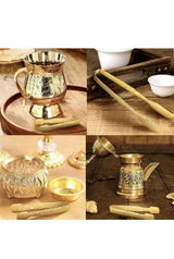 A collage showing a metallic coffee pot and matching accessories in warm wooden settings. The collage includes a gold-toned coffee pot, long wooden handles or tools, small bowls, and glass containers on a tabletop.
