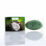Hemani Coconut Soap shown with its retail box on a reflective white surface. The soap bar is green and wrapped in clear foil, and the box features coconut and palm leaf graphics with the Hemani brand name.