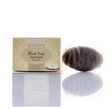 Hemani Musk Soap shown with its beige patterned retail box and a dark brown oval-shaped wrapped soap bar on a white reflective surface.