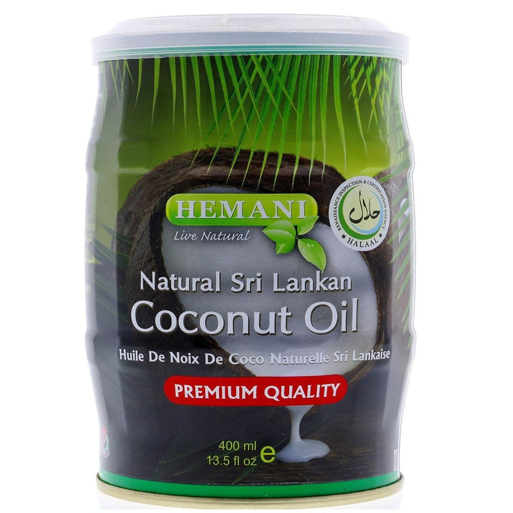 A 400 ml plastic canister of Hemani Natural Sri Lankan Coconut Oil on a white background. The label features green palm leaves, a sliced coconut, and a red banner indicating 'PREMIUM QUALITY'.Hemani Pure Sri Lankan Coconut Oil 400ml