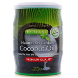 A 400 ml plastic canister of Hemani Natural Sri Lankan Coconut Oil on a white background. The label features green palm leaves, a sliced coconut, and a red banner indicating 'PREMIUM QUALITY'.Hemani Pure Sri Lankan Coconut Oil 400ml