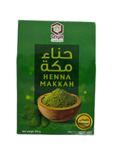 A green stand-up pouch of Henna Makkah, featuring Arabic text, the brand logo, and a bowl illustration of the green henna powder on a white background.
