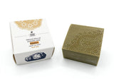 Olive oil aromatic soap with decorative packaging on a white background