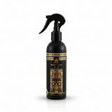 A black spray bottle of Winwam Kuaibi & Cover Scent with ornate gold and white label detailing, set against a plain white background.