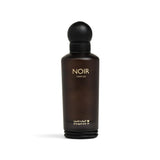 A dark brown glass perfume bottle with a matte black spherical cap, featuring the text 'NOIR PARFUM' in gold on the front, set against a plain white background.Noir – Woody Fruity EDP 150ml – Al Majed Oud