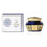 Blue and gold container with decorative design next to its packaging on a white background Al Azraq Oud Muattar Bakhoor 40g – Khadlaj