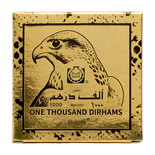 Gold-colored square packaging box for Surati One Thousand Dirhams incense, featuring a black illustration of a falcon and Arabic text.Bukhoor One Thousand 40g – Surrati