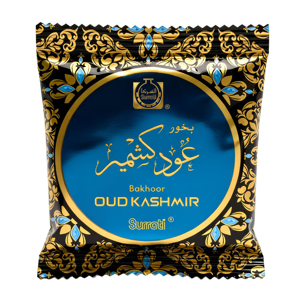 A single packaged product on a plain white background. The package is a decorative black and blue pouch with ornate gold patterns and a large blue circular label reading 'Bakhoor OUD KASHMIR' and 'Surrati'.