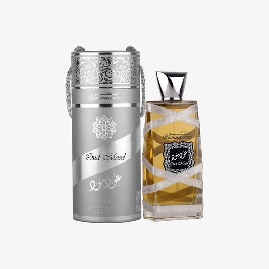 Two perfume bottles, one silver and one gold, on a white background