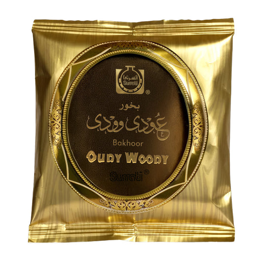 Gold packaging of oudy woody bakhoor with brand logo on a white backgroundOudy Woody Choco Bakhoor 40g – Surrati