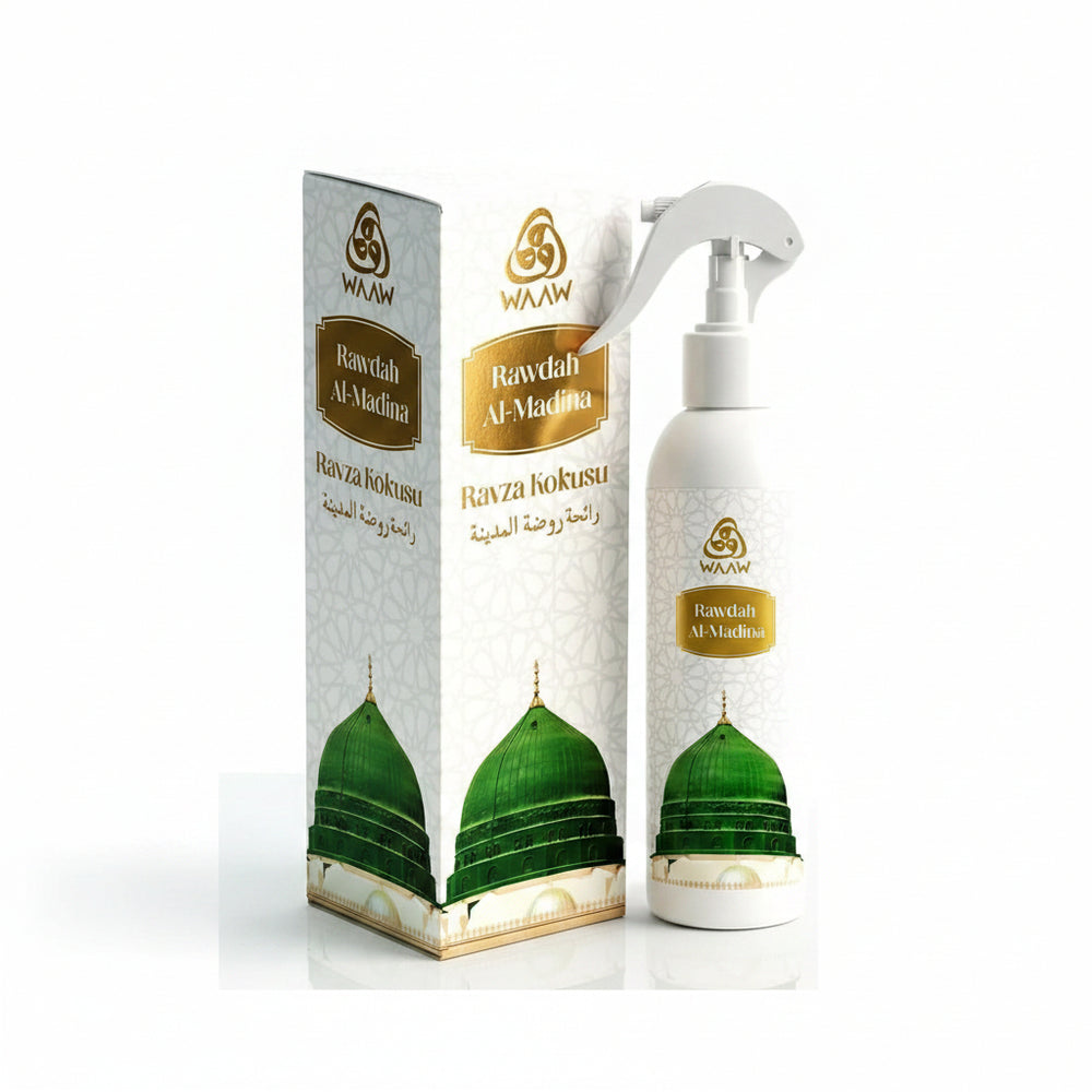 WAAW Rawdah Al-Madina fragrance oil set, featuring a white spray bottle and its matching outer packaging box, both decorated with gold lettering and a green mosque dome illustration.