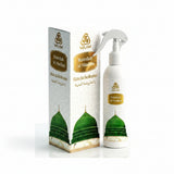 WAAW Rawdah Al-Madina fragrance oil set, featuring a white spray bottle and its matching outer packaging box, both decorated with gold lettering and a green mosque dome illustration.