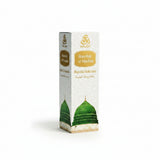 WAAW Rawdah Al-Madina Ravza Kokusu perfume box, featuring a white background with gold Arabic and English lettering, a gold WAAW logo, and an illustration of the green dome of Mecca.