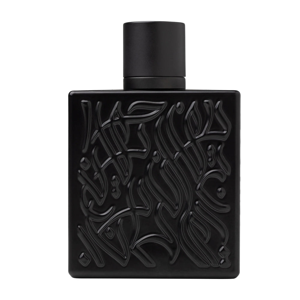 Black perfume bottle with intricate design on a white background